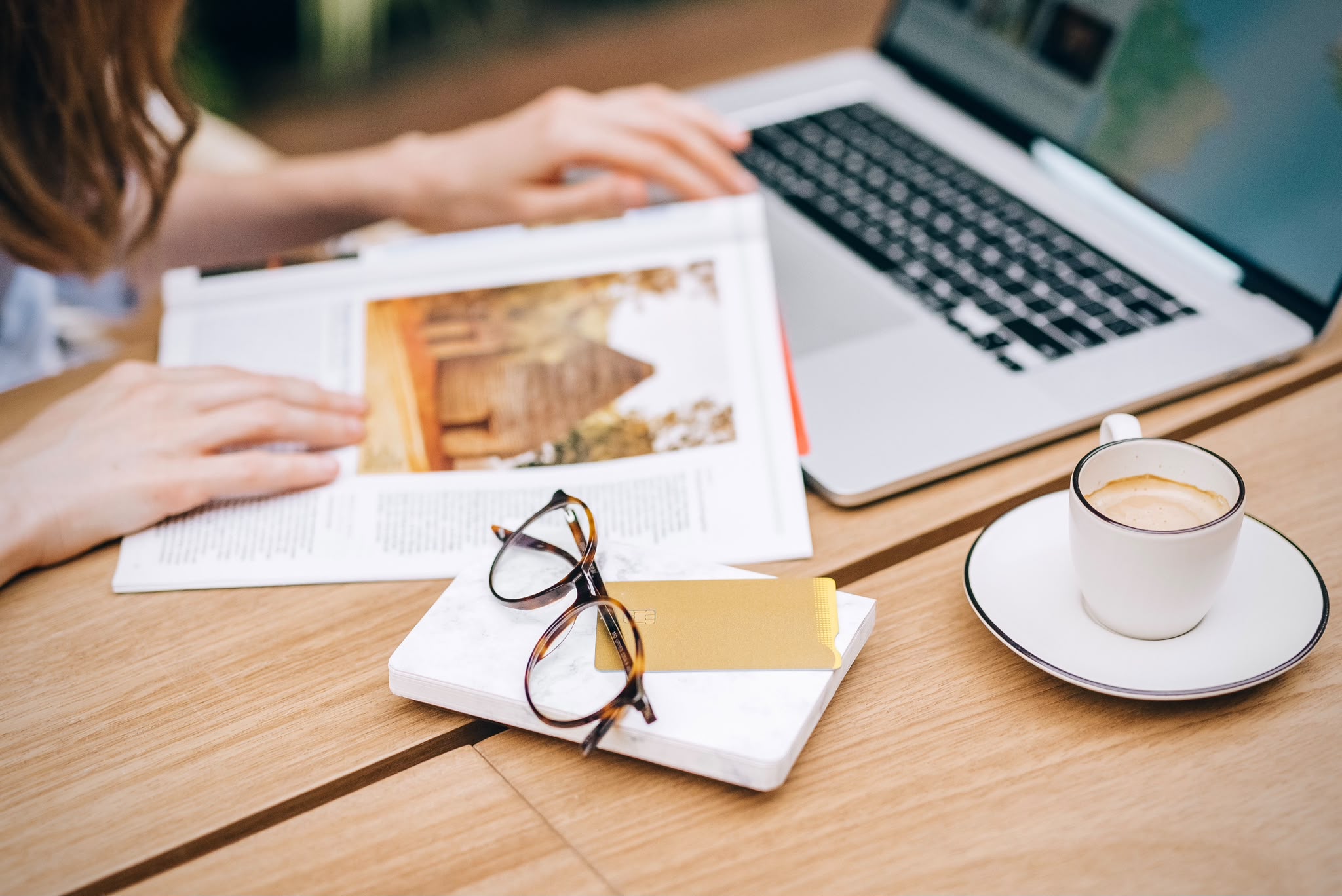 Planning an itinerary over coffee with a travel magazine